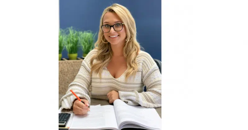 Kelly Kaczmarczyk studying for CERTIFIED FINANCIAL PLANNER™ Designation